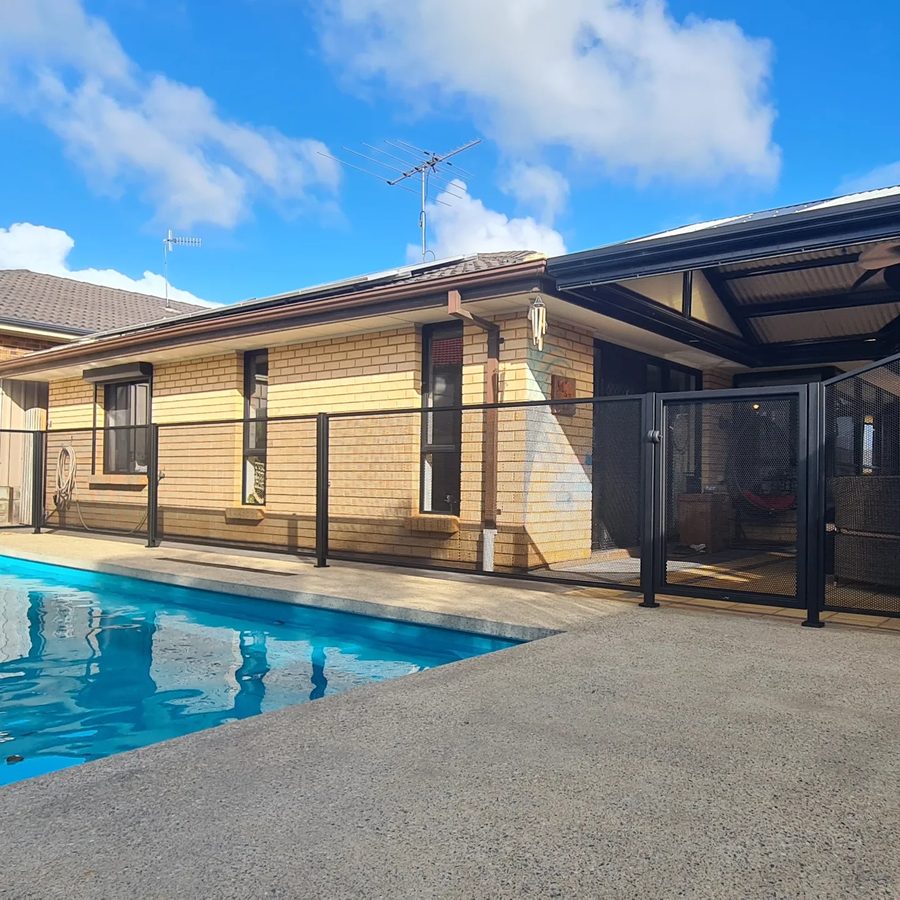 Close-up of Pure Perf perforated aluminium pool fence panel in Textured Black, Adelaide