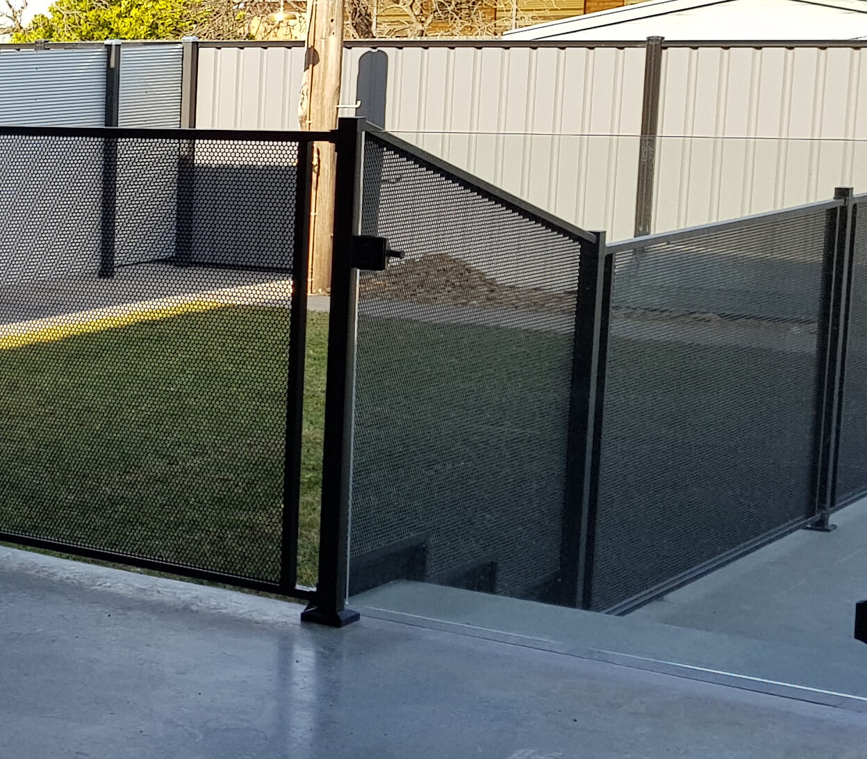 Pure Perf fencing with tapered step panels and gate, Victoria